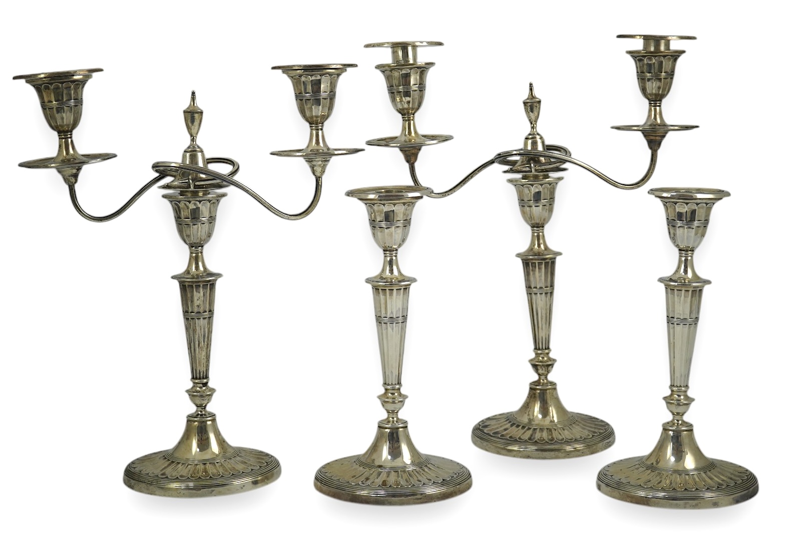 A pair of Edwardian silver two branch, two light candelabra, by Walker & Hall and a pair of matching candlesticks